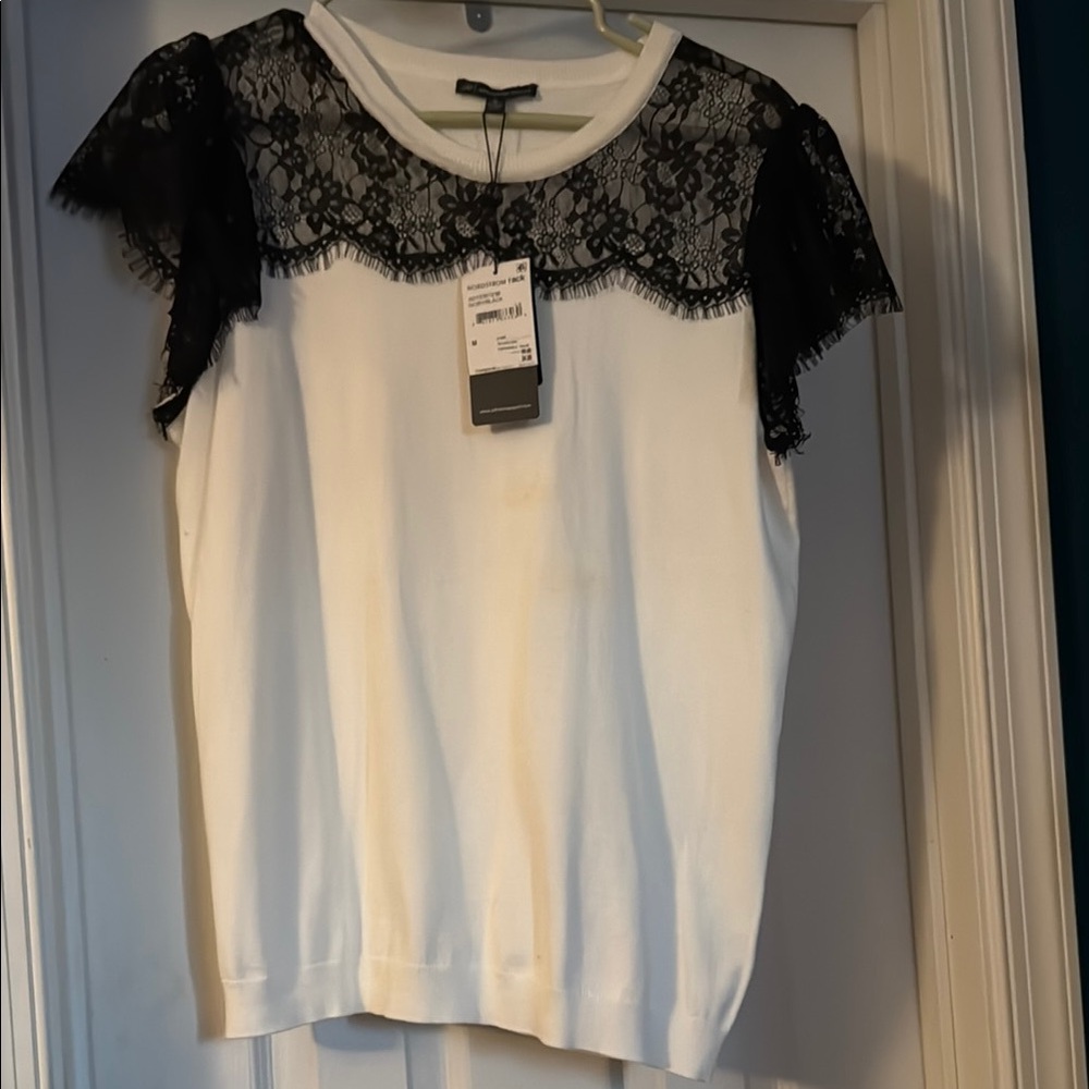 Elegant White Top with Black Lace Detail